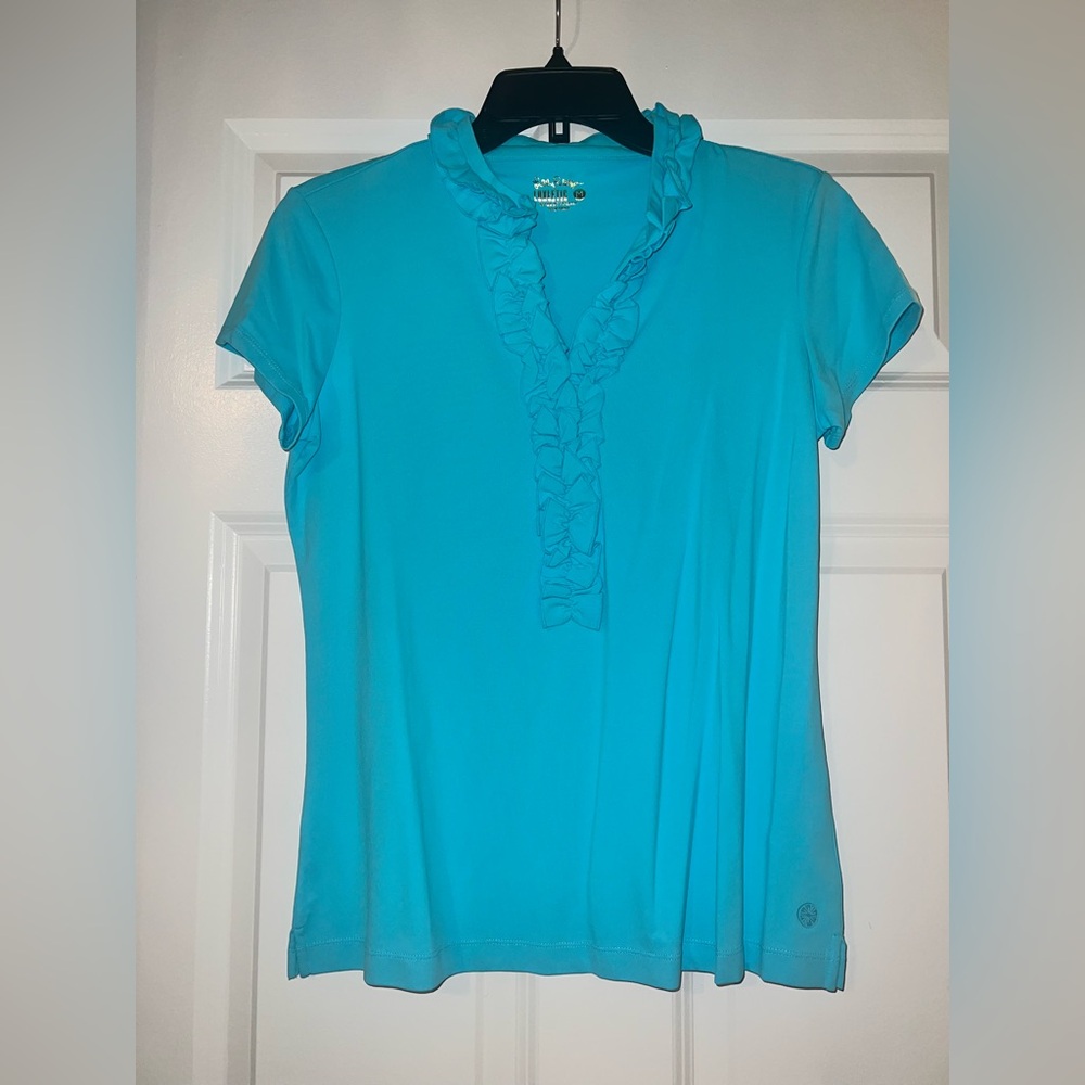 UPF 50 Luxletic Frida Ruffle Polo
Top in blue horizon Medium only worn once